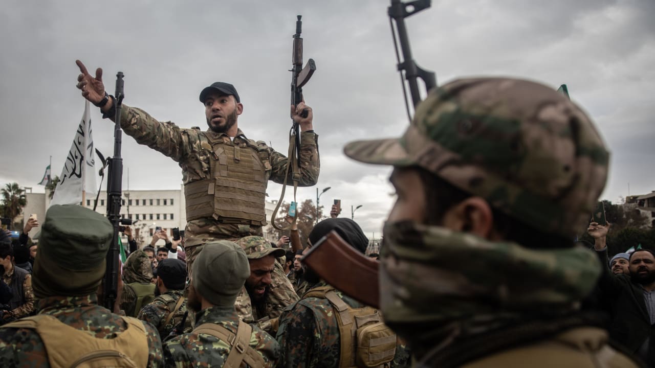 Soldiers from Hay’at at Tahrir al-Sham (HTS), a prominent Sunni Islamist militant group and political organization formerly affiliated with al-Qaeda, hold a demonstration in Damascus, Syria.