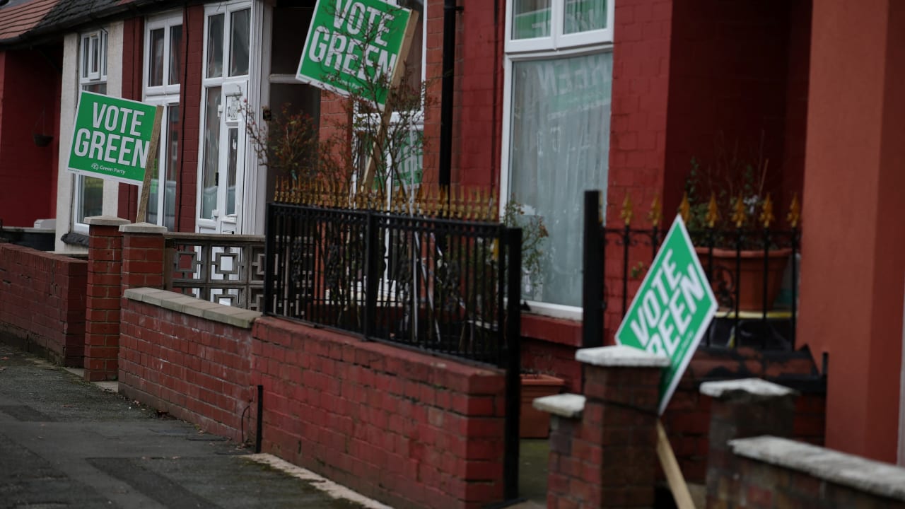 Signs in support of the Green Party stand outside houses in the constituency of Gorton and Denton ahead of a parliamentary by-election, in Manchester, Britain, February 18, 2026.