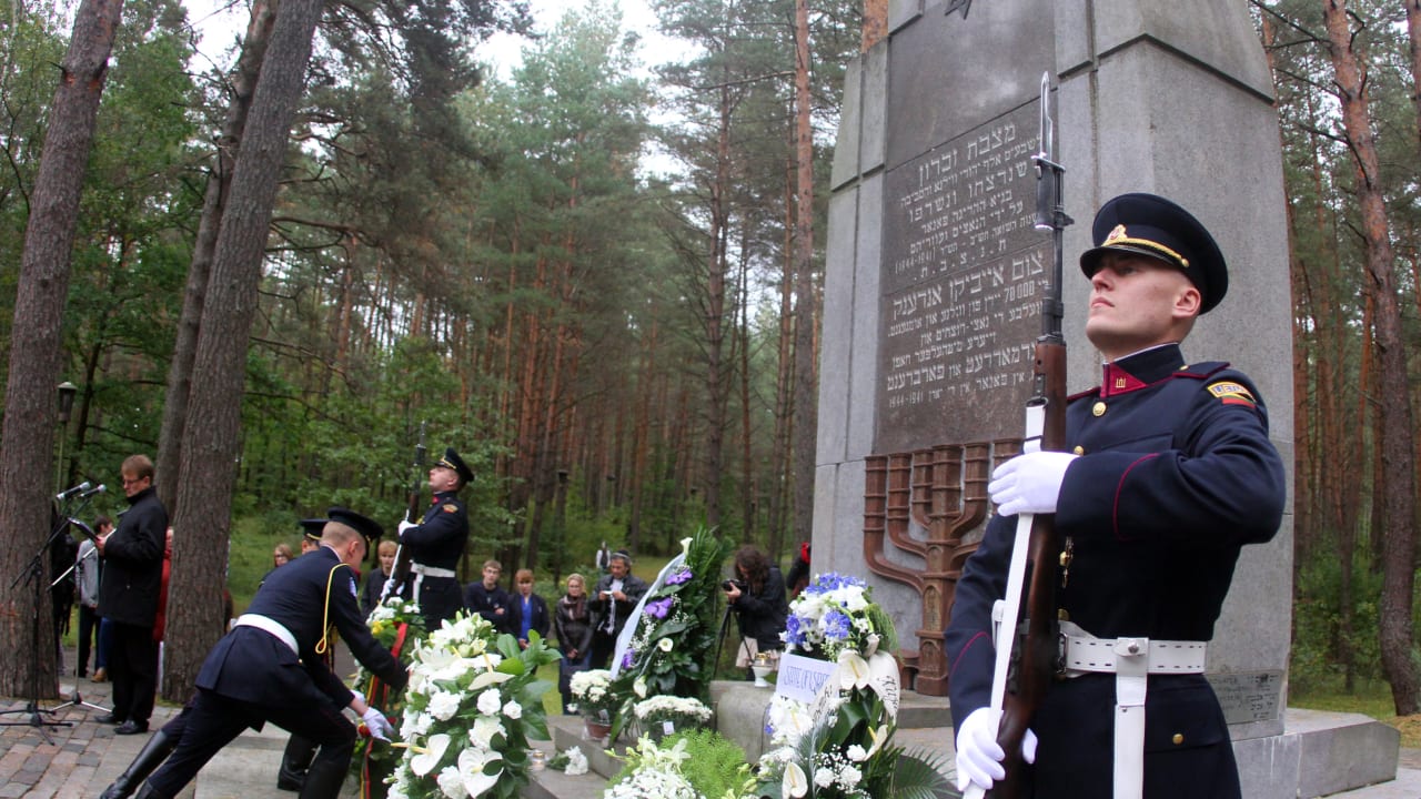 LITHUANIAN SOLDIERS lay a wreath during the Lithuanian-Jewish genocide commemoration ceremony honoring Holocaust victims, in Paneriai, near Vilnius. 