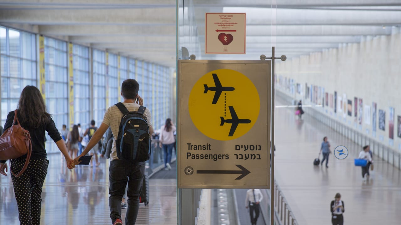 An Israeli couple walks towards the Arrivals gate in the Ben Gurion International Airport in Tel Aviv, Israel on April 30, 2016