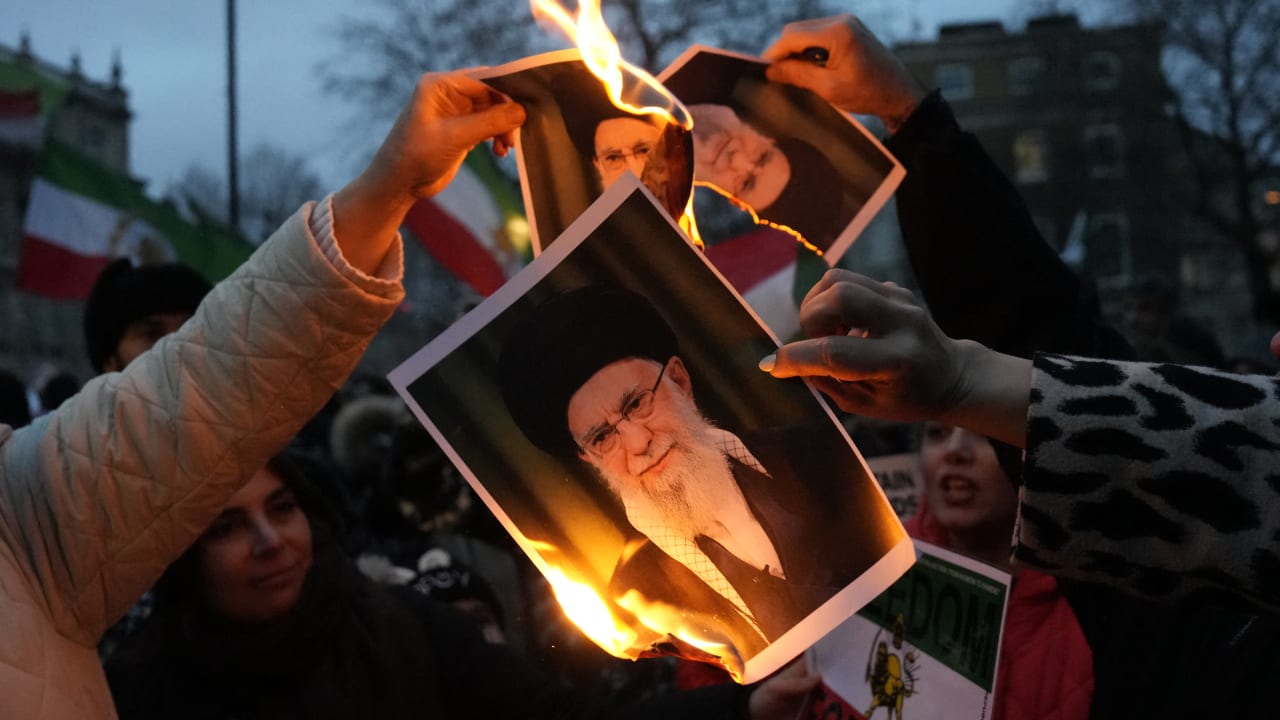 Protestors burn images of Ayatollah Ali Khamenei during a rally held in Solidarity with Iran's Uprising, organised by The national Council of Resistance of Iran, on Whitehall in central London on January 11, 2026.