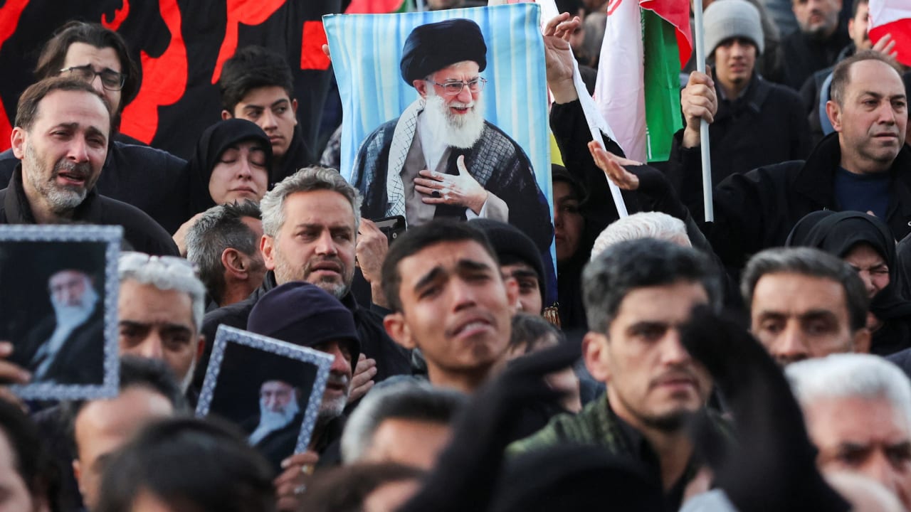 PEOPLE REACT as they gather at the Enghelab Square, after Iran's Supreme Leader Ayatollah Ali Khamenei was killed in Israeli and US strikes on Saturday, in Tehran, Iran, March 1, 2026. 