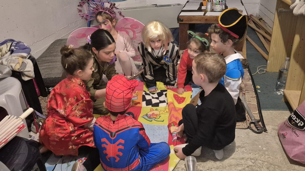 Israeli children celebrate Purim in a bomb shelter, March 2, 2026.