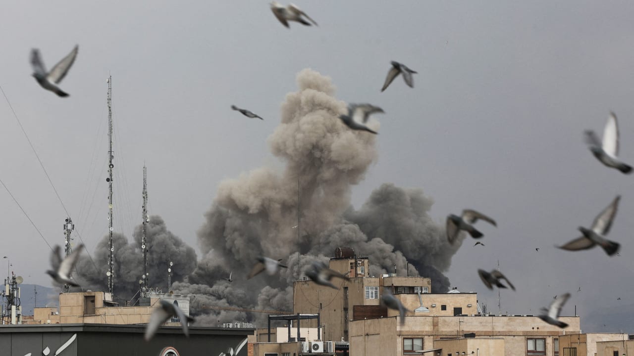 Birds fly as smoke rises following an explosion, after Israel and the US launched strikes on Iran, amid the US-Israel conflict with Iran, in Tehran, Iran, March 2, 2026.