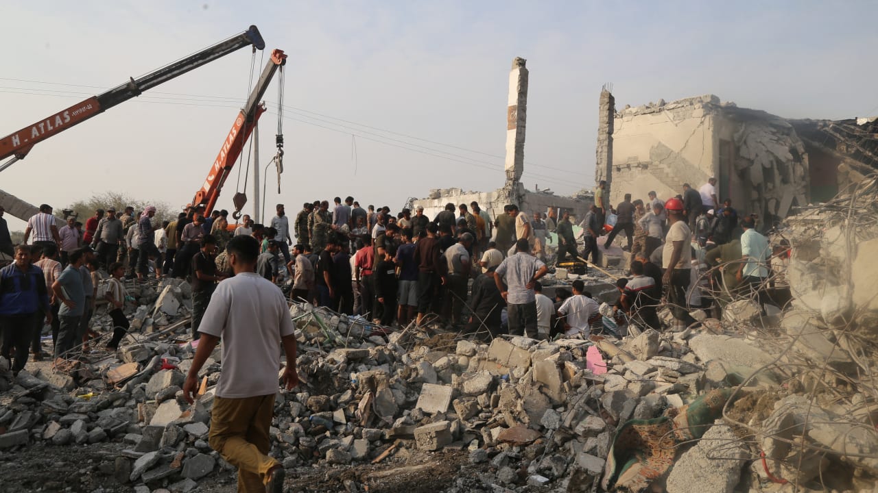 People and rescue forces work following an Israel strike on a school in Minab, Iran, February 28, 2026. 