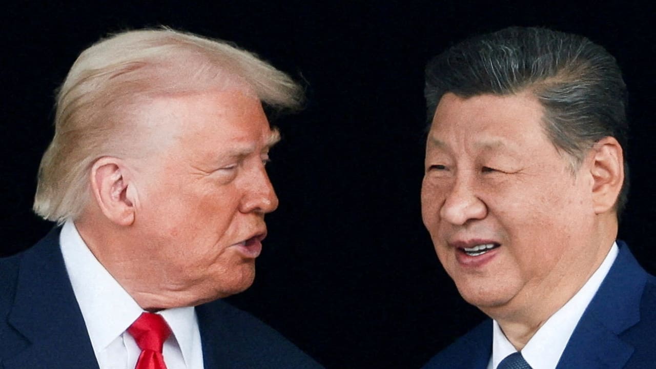 US President Donald Trump and Chinese President Xi Jinping talk as they leave after a bilateral meeting at Gimhae International Airport, on the sidelines of the Asia-Pacific Economic Cooperation (APEC) summit, in Busan, South Korea, October 30, 2025.