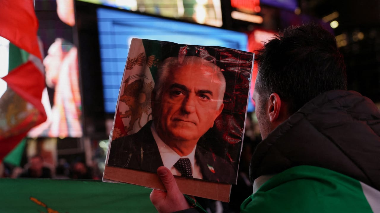 A demonstrator displays a portrait of Reza Pahlavi, the exiled son of Iran's last shah, as people rally against Iran's ruling establishment, following US and Israel strikes on Iran, in New York City, US, March 2, 2026.
