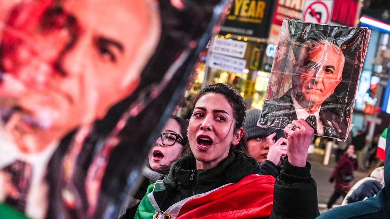 A woman holds a portrait of Reza Pahlavi, son of the last shah of Iran, during a “Freedom for Iran” protest in support of the Iranian people in New York on March 2, 2026.