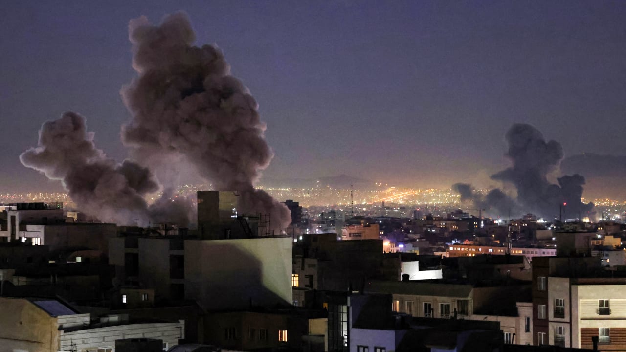 Smoke plumes rise following missile strikes in Tehran on March 1, 2026.