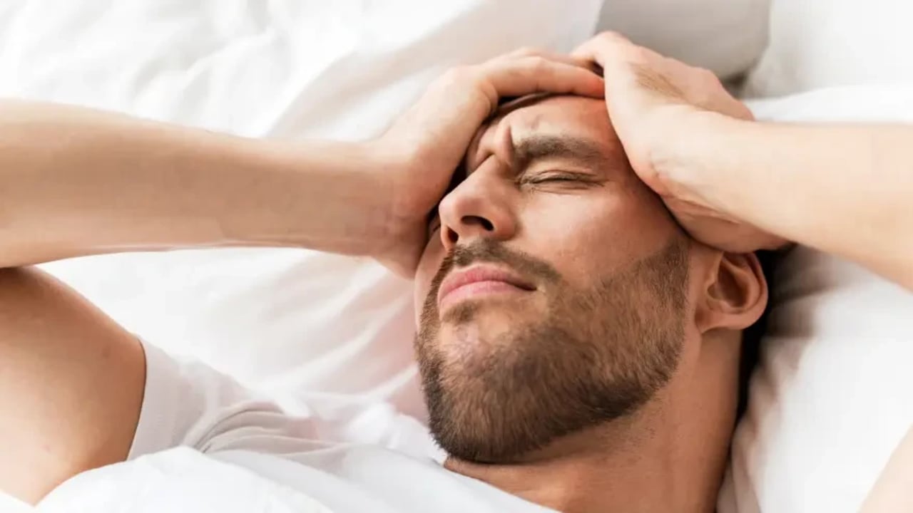 A man suffering from a headache 
