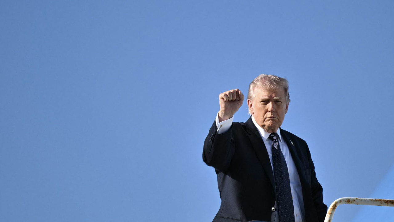 US President Donald Trump gestures as he boards Air Force One on March 1.