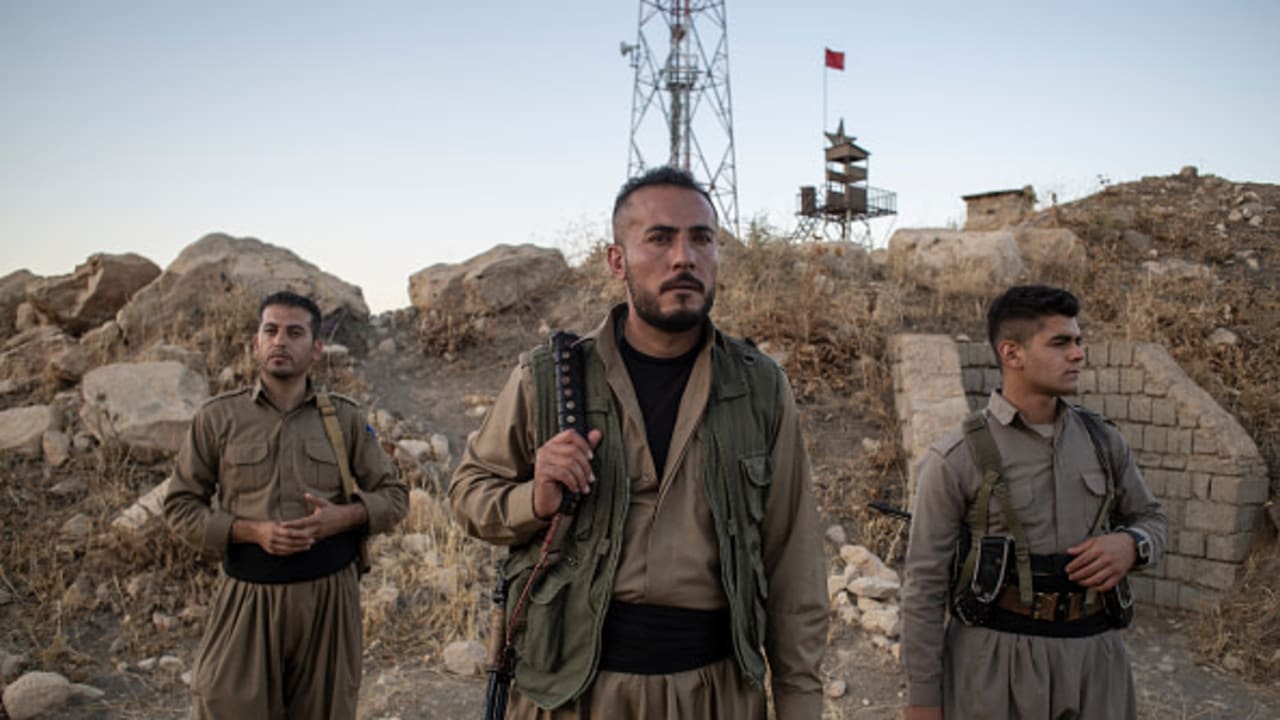 Erfan Mortezaei, Mahsa Aminis cousin and his colleagues stand among the mountain on October 04, 2022 in Sulaymaniyah, Iraq as part of Komala Kurdistan's Organization of the Communist Party of Iran.