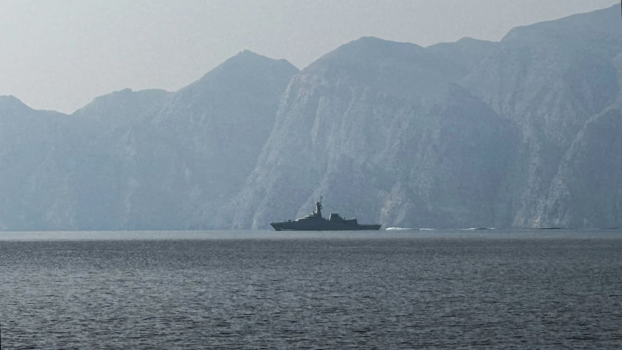 A navy vessel is seen sailing in the Strait of Hormuz, a vital waterway through which much of the world's oil and gas passes on March 1, 2026.