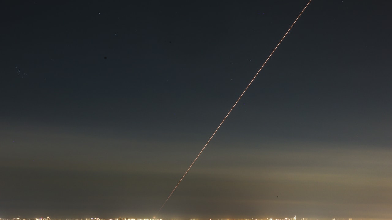Anti-missile system fires interception missiles as missiles fired from Iran as it seen over central Israel, March 5, 2026.