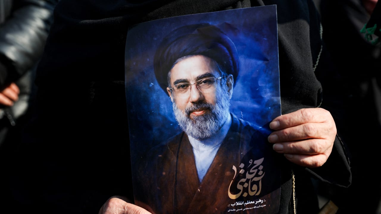 A woman holds a portrait of Iran's new supreme leader Mojtaba Khamenei, on the day of a gathering to support Mojtaba Khamenei, amid the US-Israeli conflict with Iran, in Tehran, Iran, March 9, 2026. 
