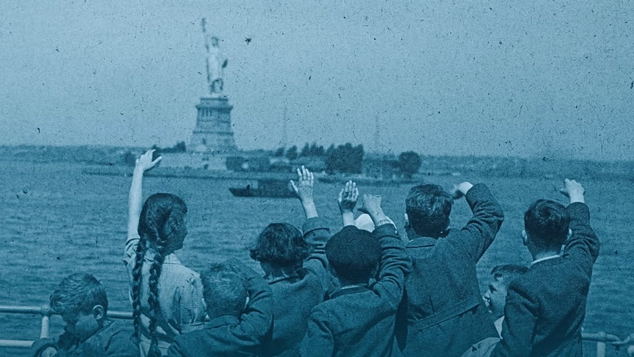 A group of young Austrian immigrants wave to the Statue of Liberty upon their arrival in America aboard the S.S. Harding. The 50 Jewish children, who were greeted by their new adoptive families, were fleeing Nazi persecution in their homeland.