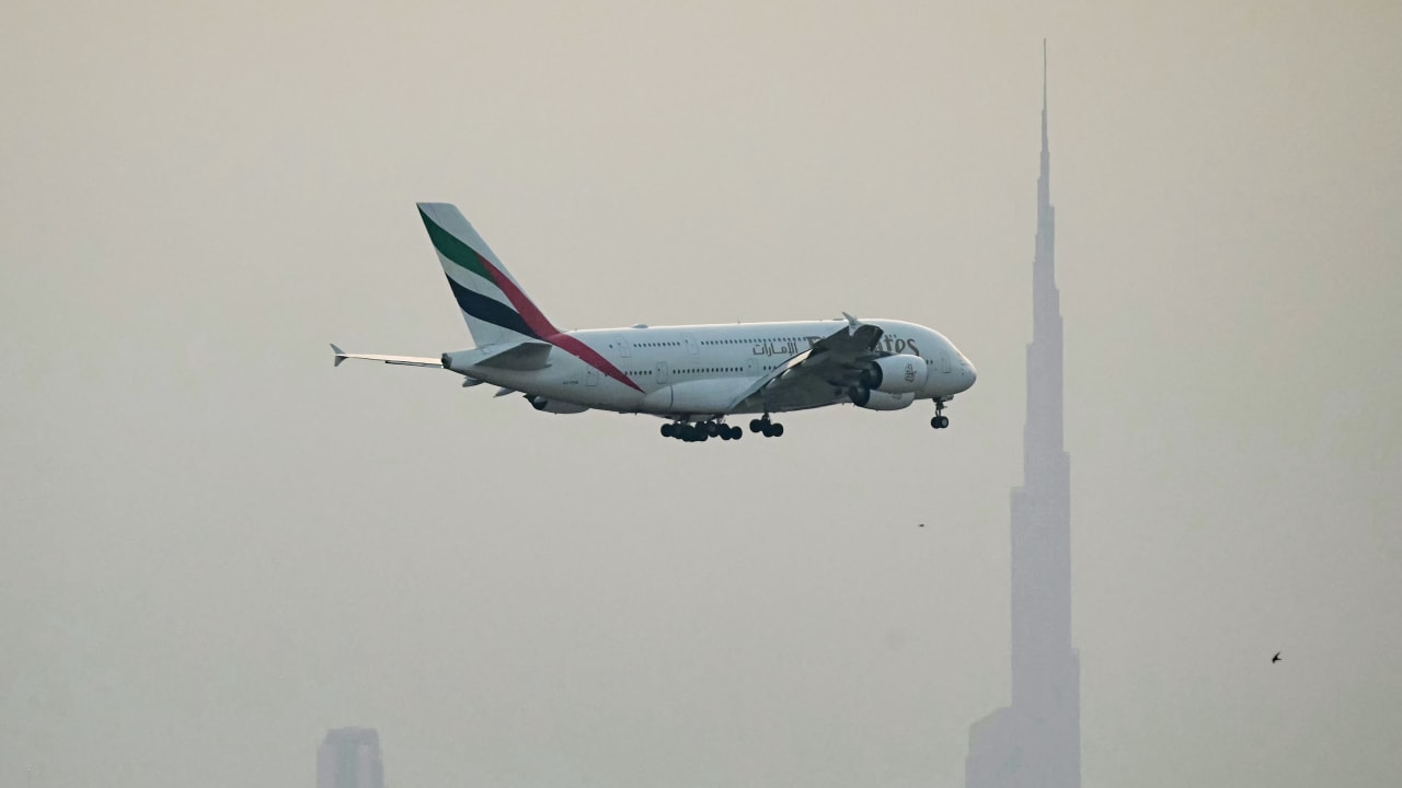 An Emirates Airbus A380 passenger aircraft prepares for landing at Dubai International Airport in Dubai on March 8, 2026. 