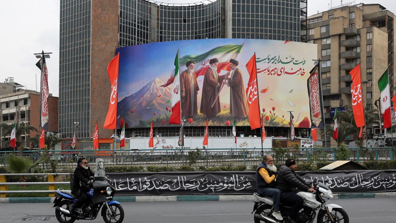 A banner of Iran's new supreme leader Mojtaba Khamenei with former supreme leaders Ali Khamenei and Ruhollah Khomeini, in Tehran, Iran, March 10, 2026