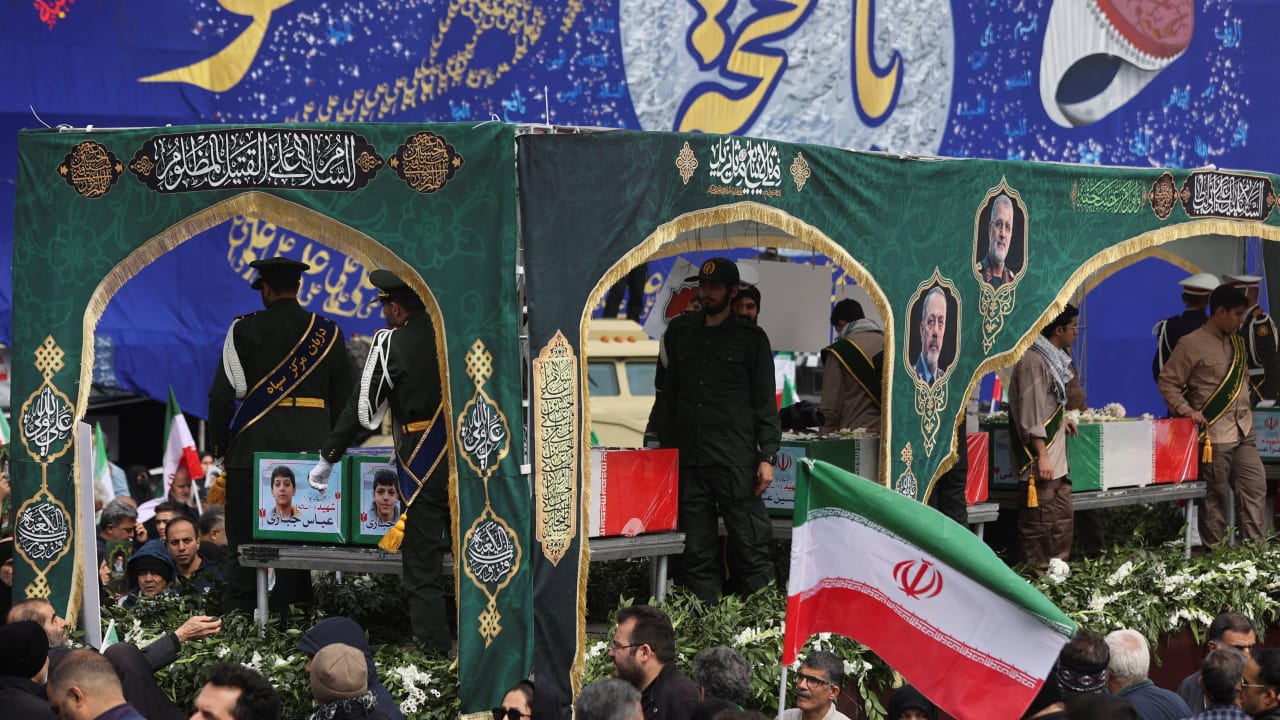 People attend a funeral ceremony for the Iranian military commanders who were killed in strikes, amid the US-Israeli conflict with Iran, in Tehran, Iran, March 11, 2026. 