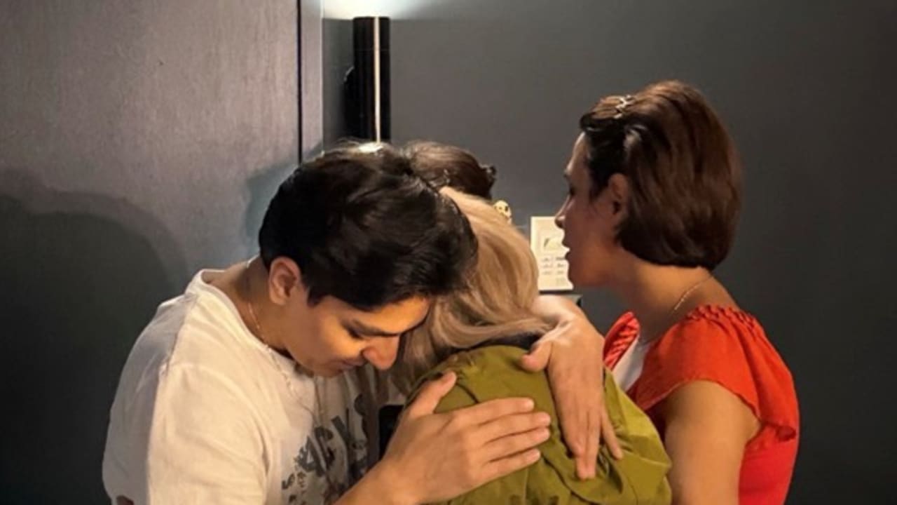 THE REMAINING members of Iran’s women’s national football team embrace a member of the support staff who had refused to board the plane. (photo credit: Tony Burke/X)