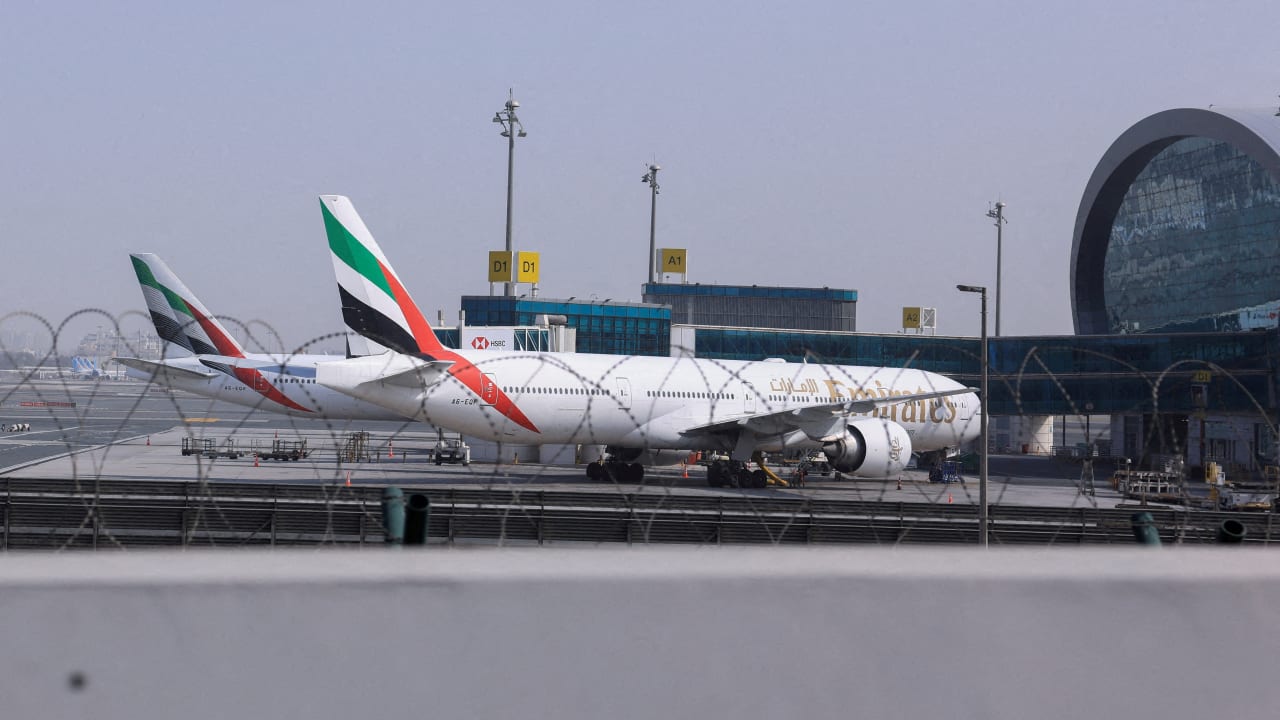 Planes are parked at Terminal 3 of the Dubai International Airport, following the United States and Israel strikes on Iran, in Dubai, United Arab Emirates, March 2, 2026. 
