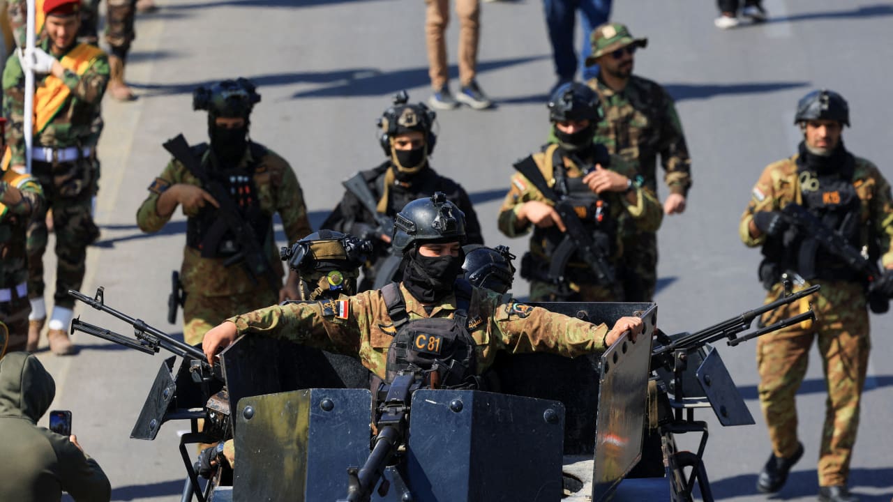 Members of the Iraqi armed group Kataib Hezbollah attend the funeral of their members, who were killed in an airstrike that targeted a Hashd al‑Shaabi headquarters near the western al‑Qaim district on the Syrian border, amid the U.S.-Israel conflict with Iran, in Baghdad, Iraq, March 2, 2026.