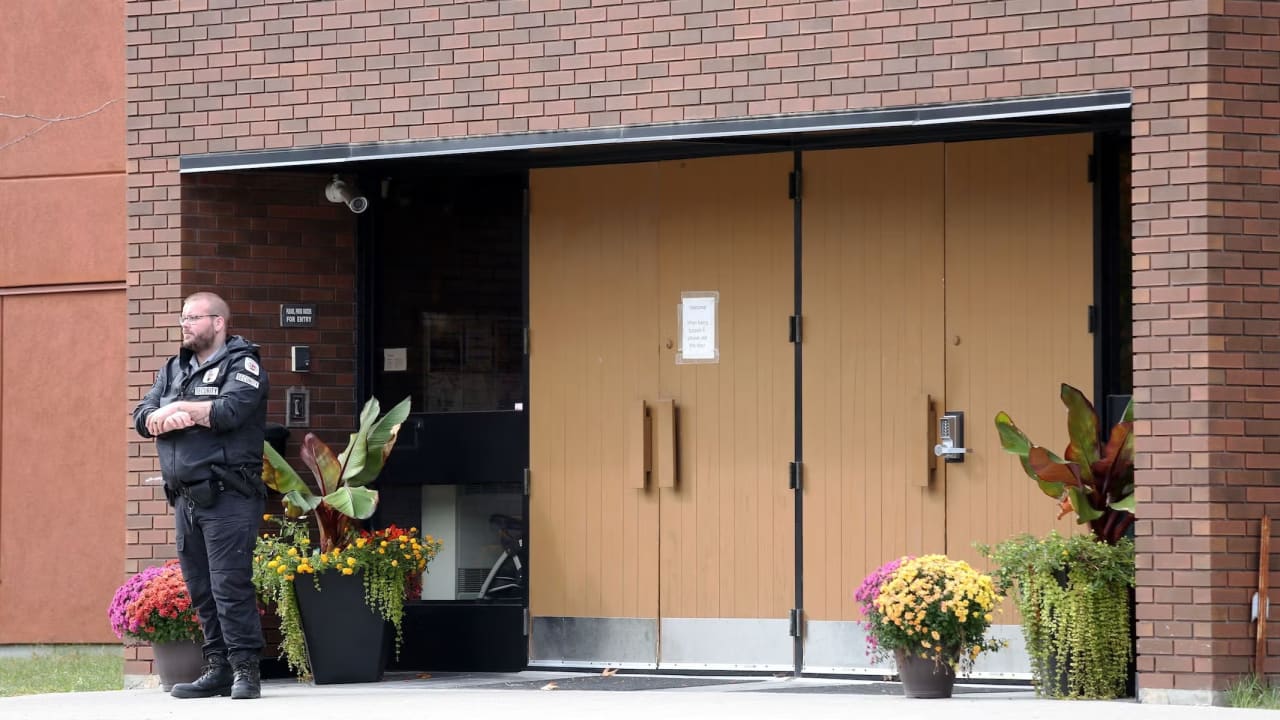 A security guard stands outside the front door of Machzikei Hadas Orthodox synagogue on Oct. 8, 2023, Ottawa, Ontario, Canada. 