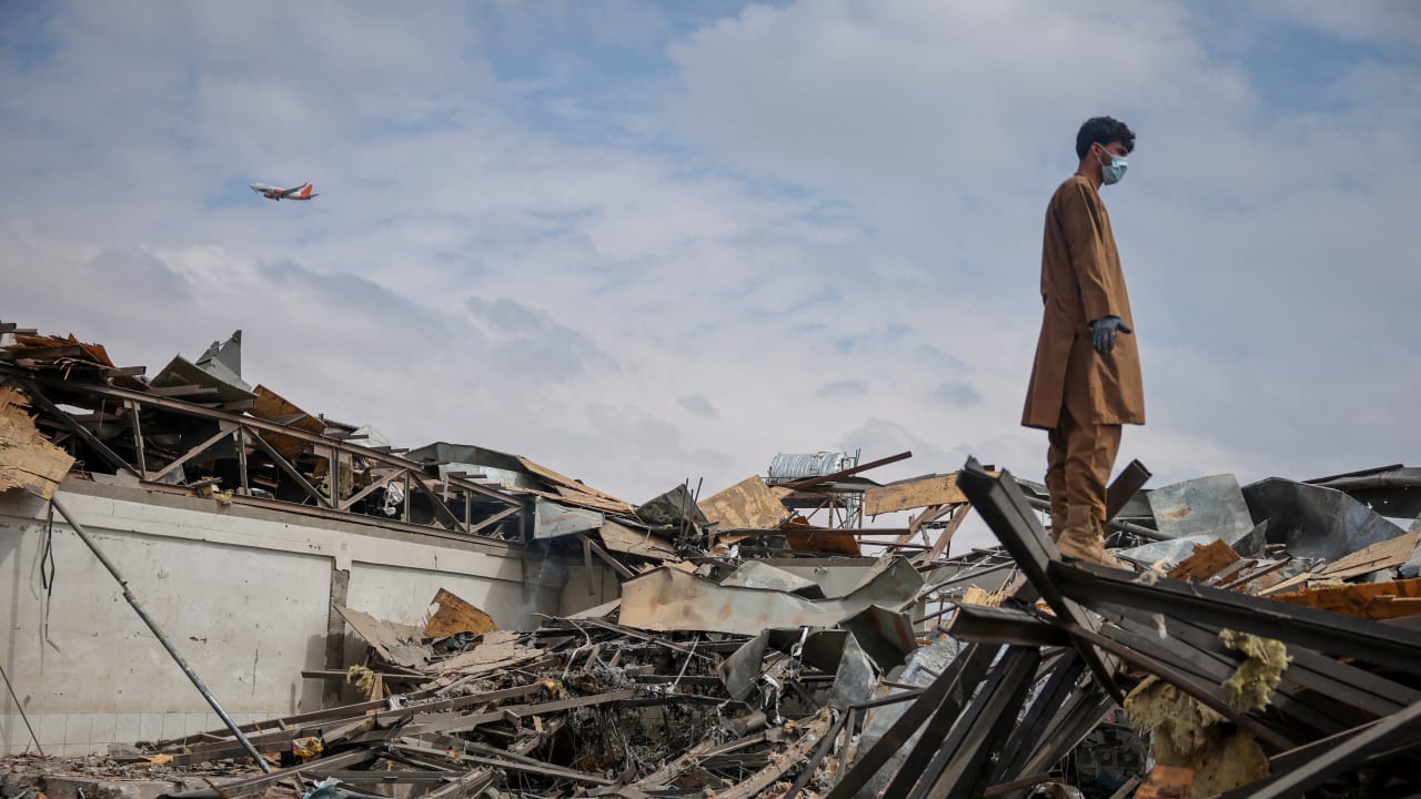 A man stands on the debris at the site of a drug rehabilitation hospital destroyed in what the Taliban said was a Pakistani air strike in Kabul, Afghanistan, March 17, 2026.