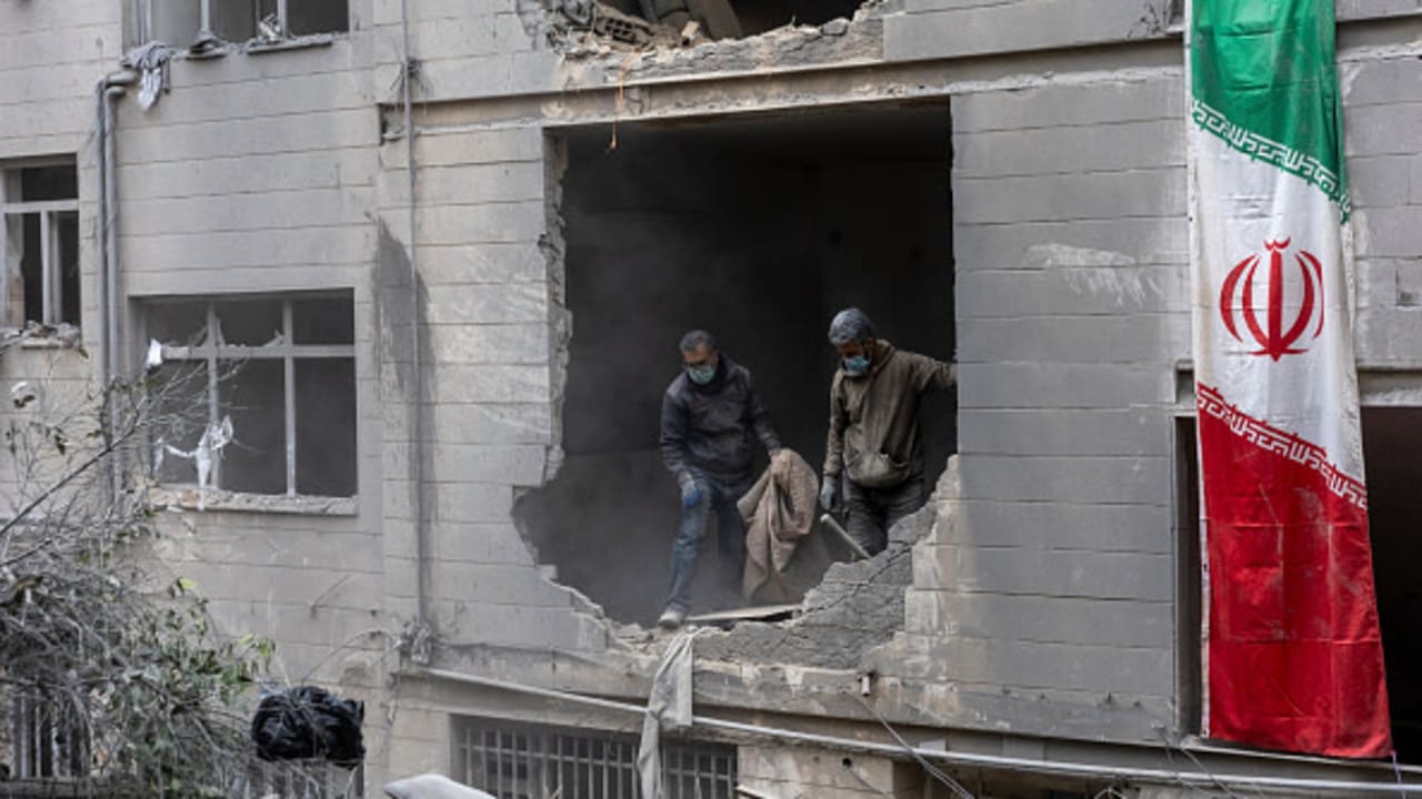 People clear rubble in a house in the Beryanak District after it was damaged by missile attacks two days before, on March 15, 2026 in Tehran, Iran. 