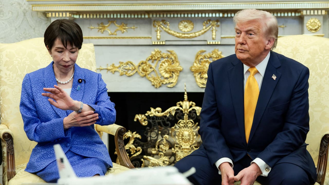 Japanese Prime Minister Sanae Takaichi looks at her watch during a meeting with U.S. President Donald Trump in the Oval Office at the White House in Washington, March 19, 2026.