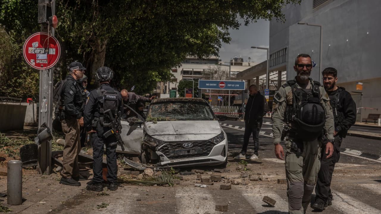 A car was damaged by shrapnel in Tel Aviv after an Iranian missile barrage.