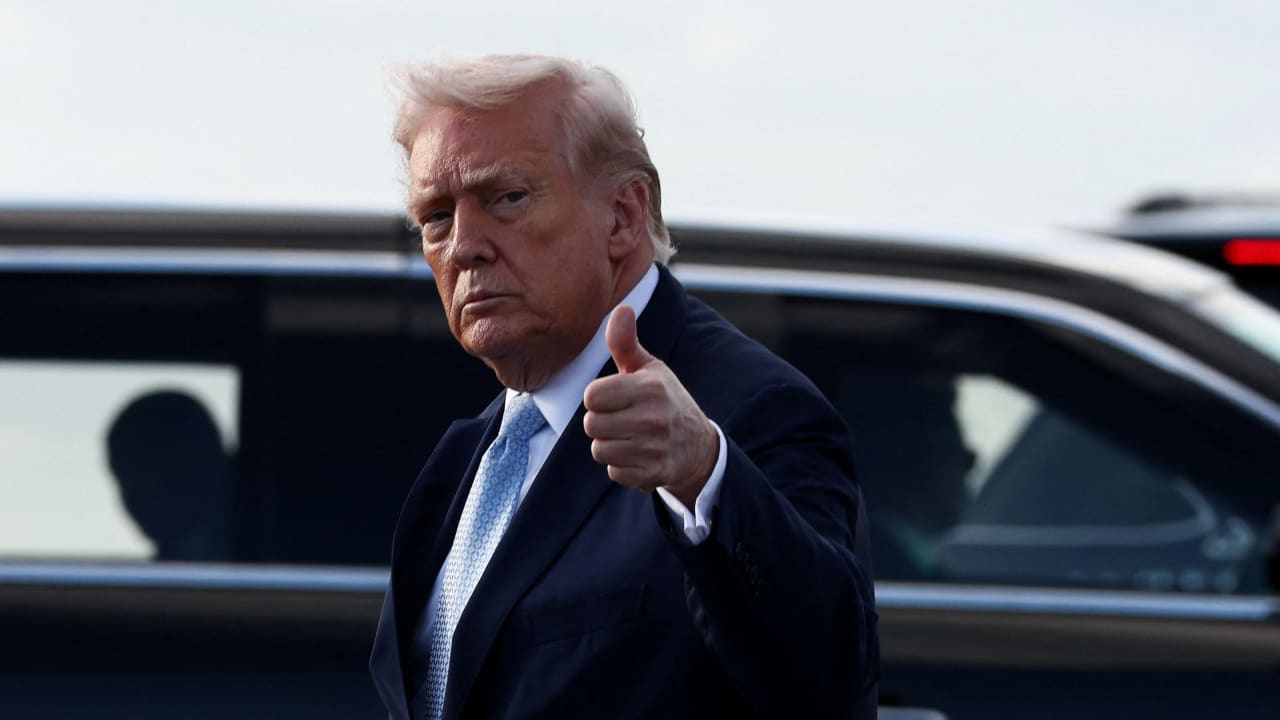 US President Donald Trump gestures as he steps from Air Force One upon his arrival in West Palm Beach, Florida, US, March 20, 2026
