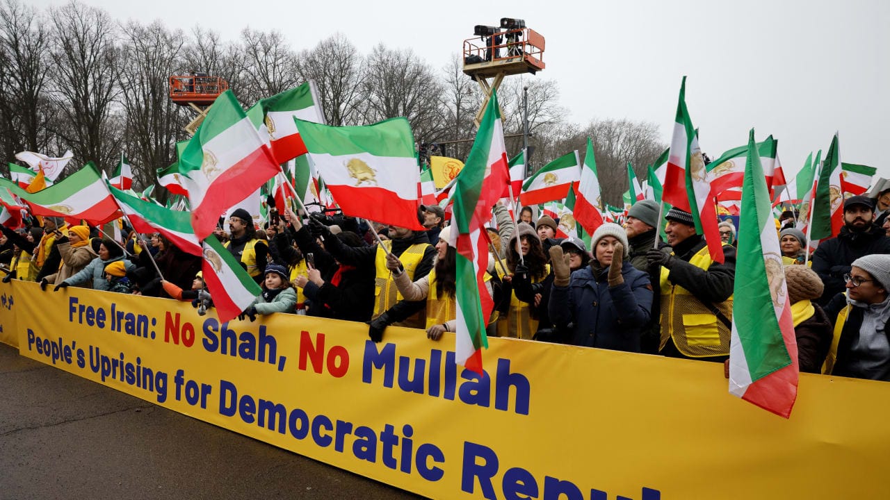 People carry a banner, as supporters of the Iranian opposition group, the National Council of Resistance of Iran, protest to demand an immediate stop to the violence against protesters in Iran and an end to detentions and repression, in Berlin, Germany, February 7, 2026