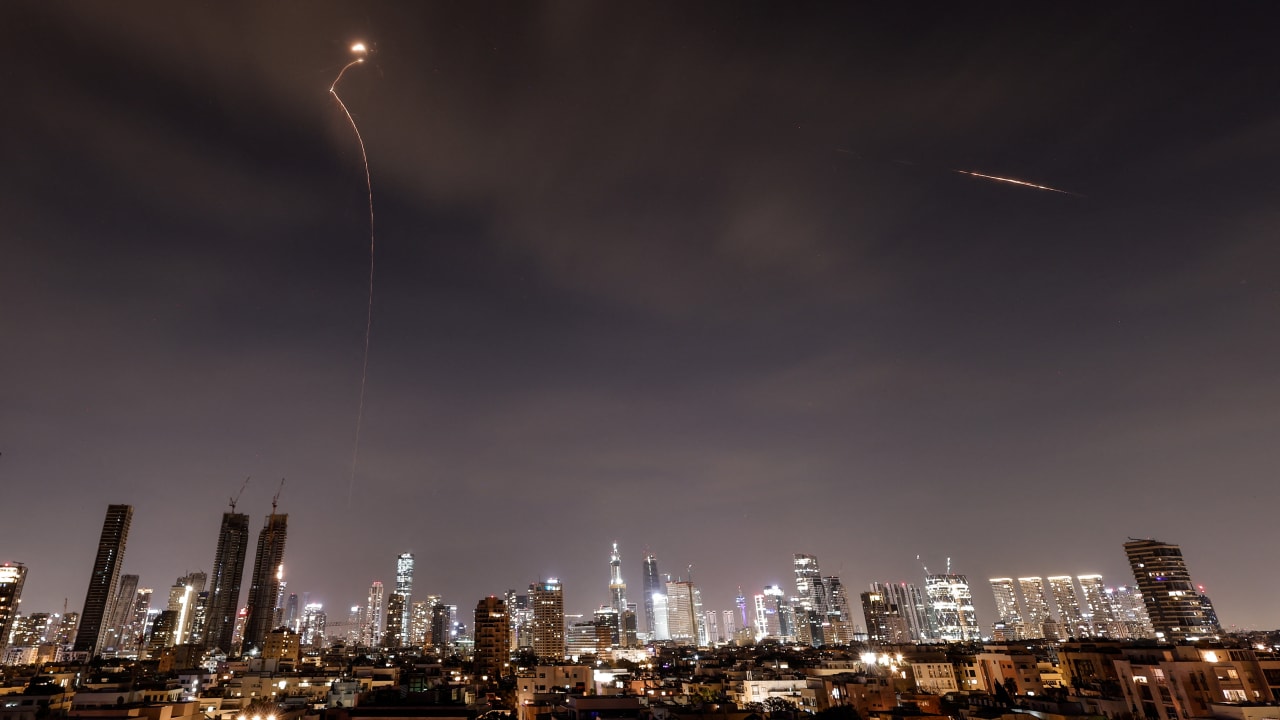 Streaks of light illuminate the sky during an interception attempt amid the US-Israeli conflict with Iran, as seen from Tel Aviv, Israel, March 23, 2026.