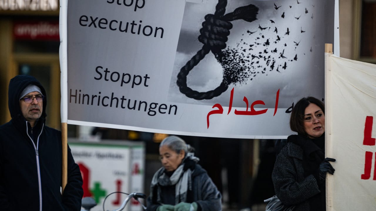 Protesters display a banner calling for a halt to executions in Iran during a rally in Berlin, Germany, on January 10, 2026, in support of the Iran protests.