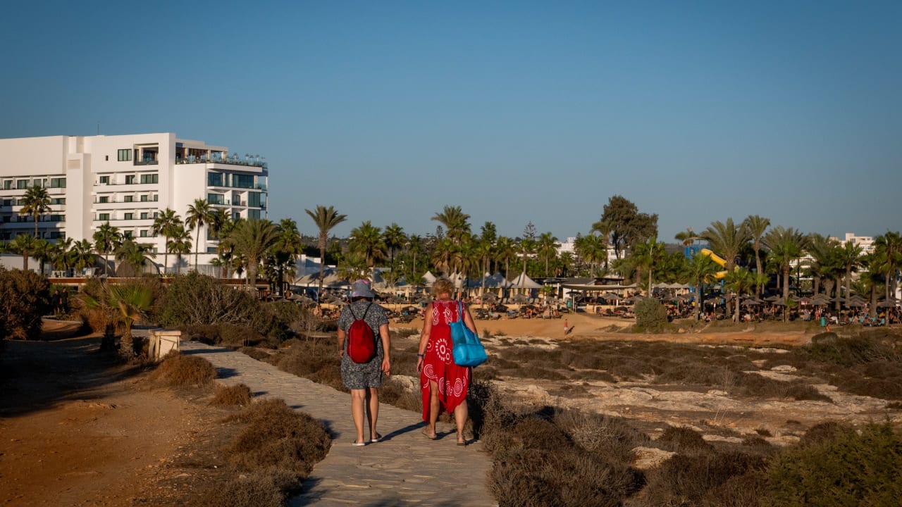 TOURISTS ENJOY the beach in Ayia Napa, Cyprus, October 5, 2024.