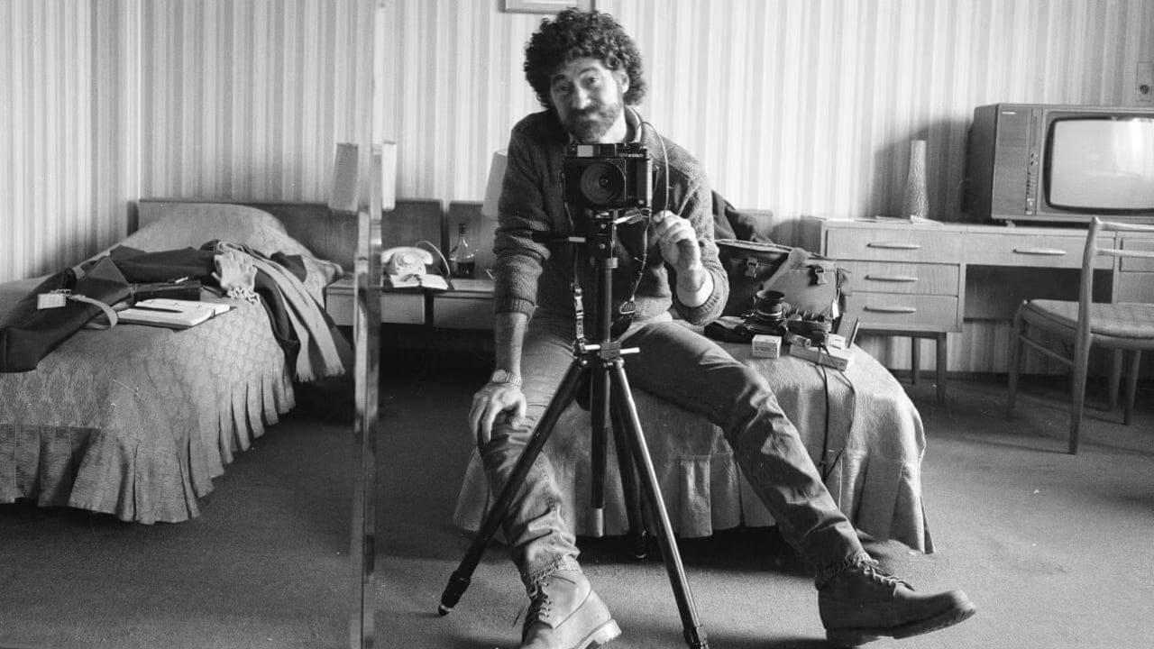 Photographer Edward Serotta takes a self-portrait in a hotel room during his efforts to document Romania in the 1980s.