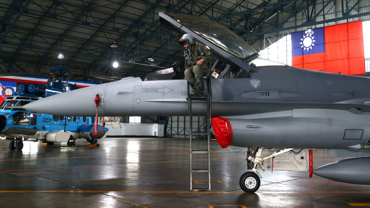 Fighter pilot Yen Hsiang-sheng gets out of a F-16V fighter jet wearing a Joint Helmet Mounted Cueing System helmet during an annual New Year's drill in Chiayi, Taiwan, January 5, 2022.