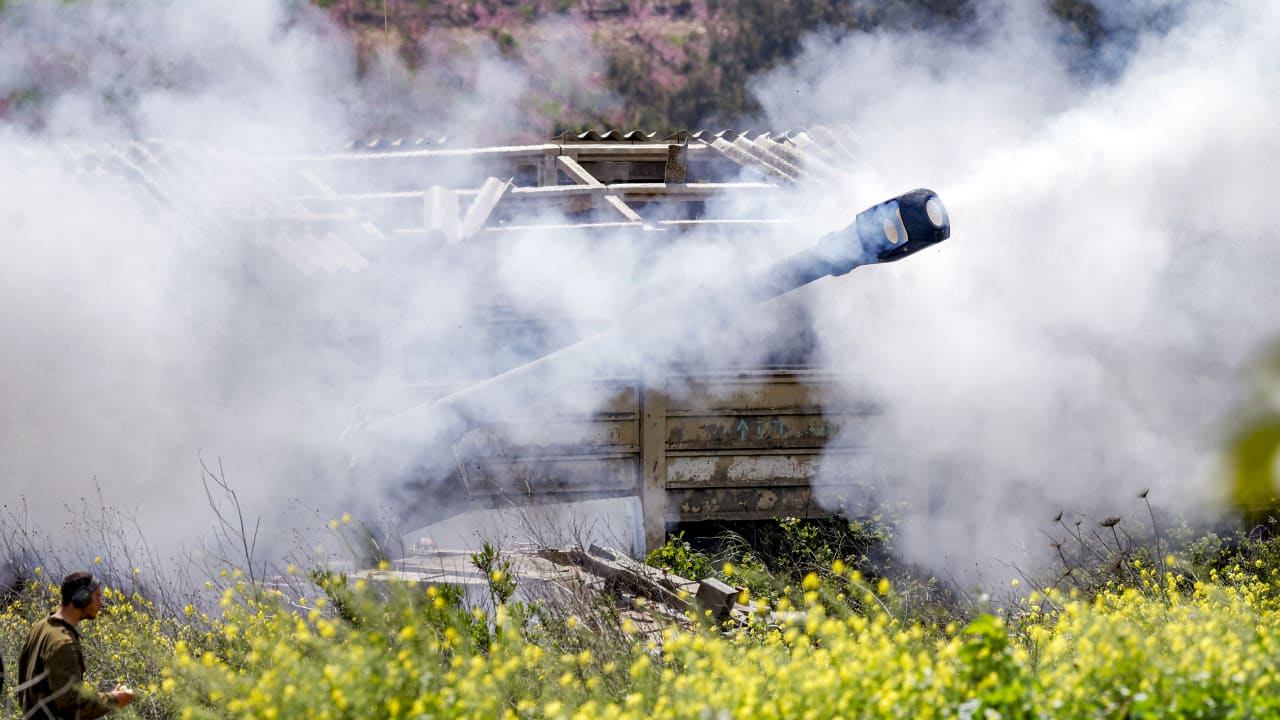 Smoke is released after an Israeli army self-propelled Howitzer artillery gun fires rounds from the upper Galilee in northern Israel near the border with southern Lebanon on March 27, 2026.