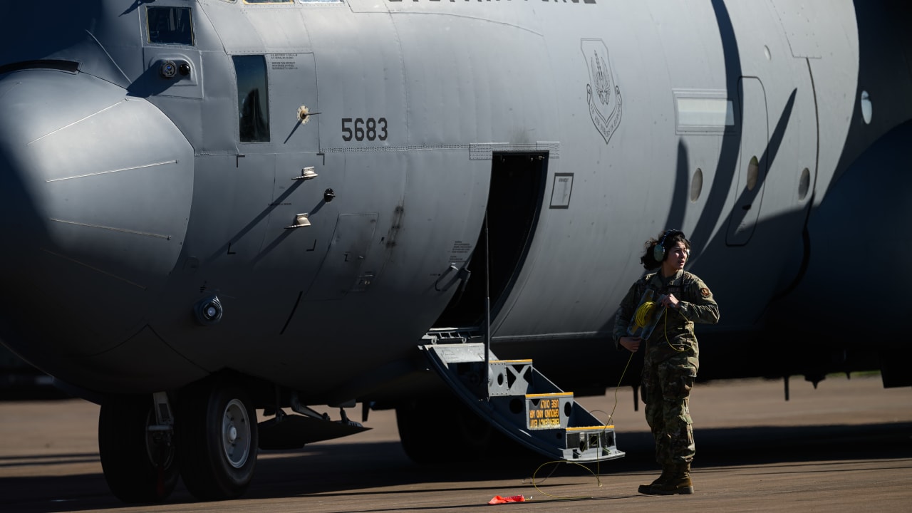 US Air Force crew work on a Lockheed Martin C-130J-30 Hercules before take-off from RAF Fairford on March 18, 2026 in Fairford, England.