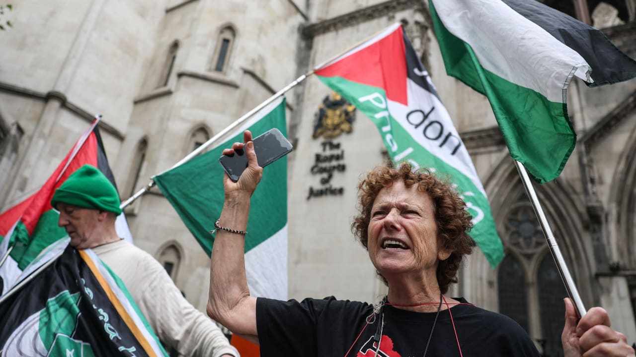 People gather outside London's High Court in London, Britain, July 30, 2025.