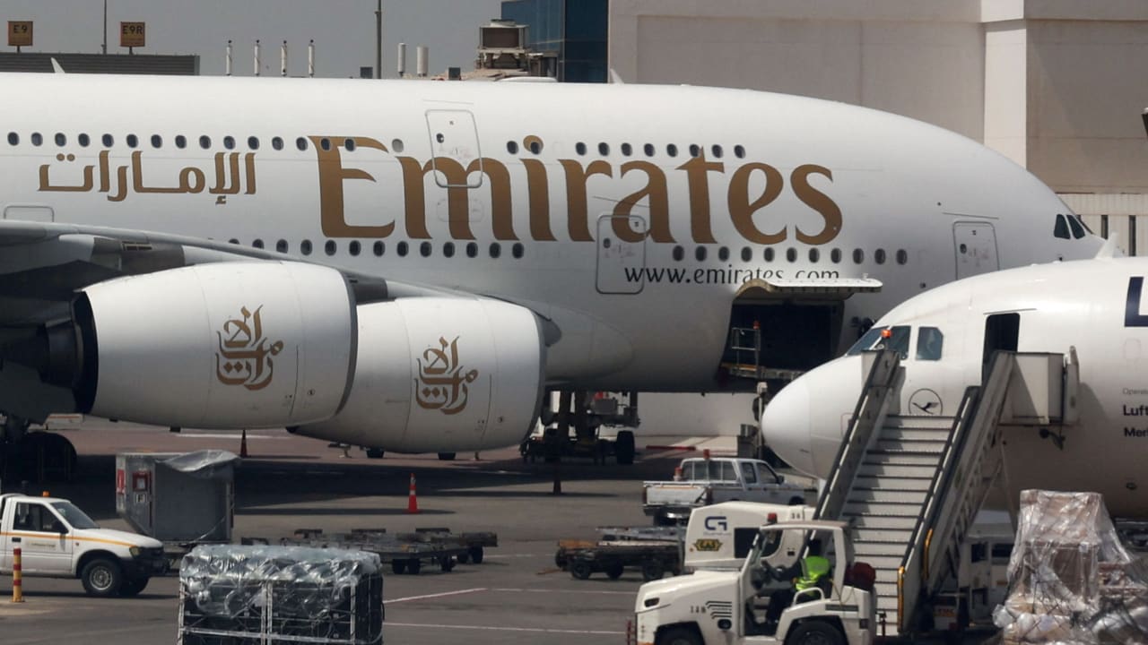 An Emirates aircraft is seen through the window of a Middle East Airlines airplane at Cairo International Airport, March 31, 2026; illustrative.