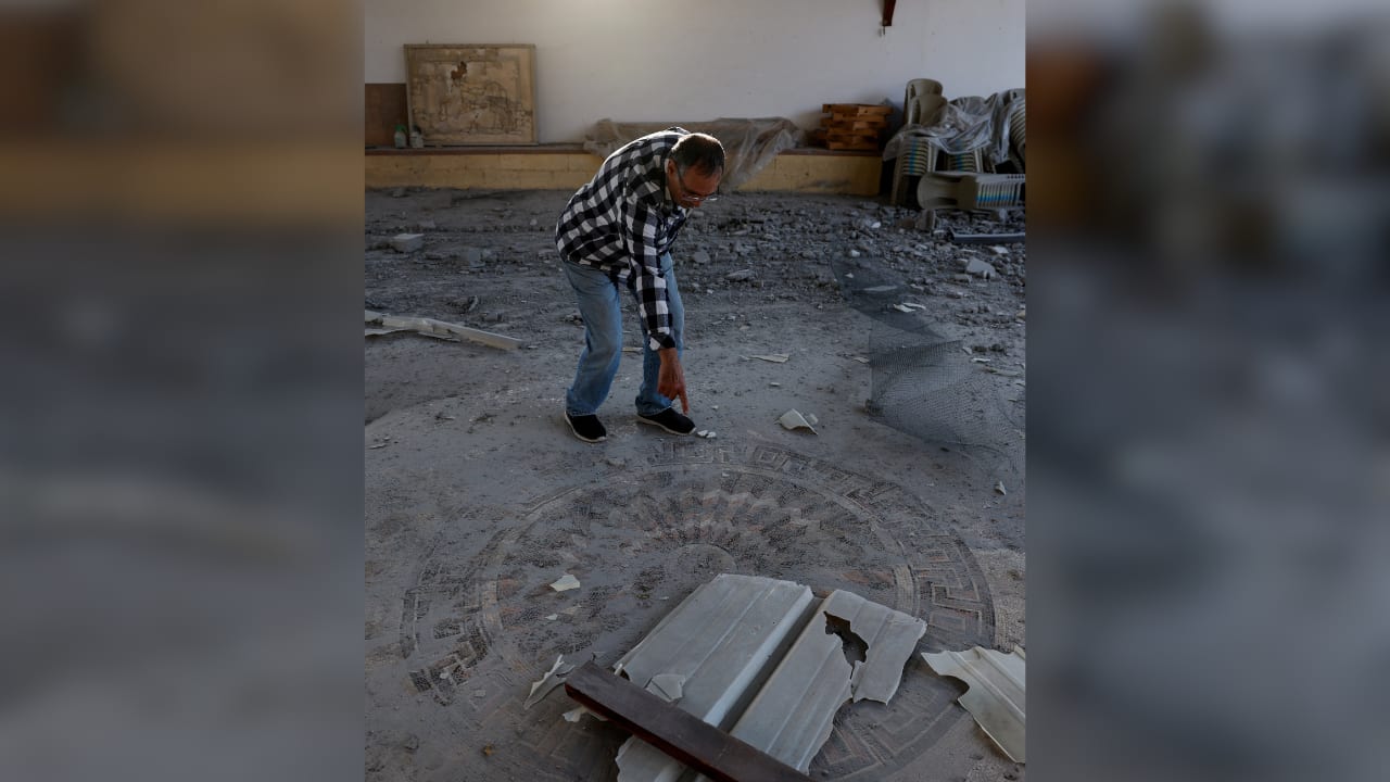 A man inspects the site of the remains of a Byzantine church, which was damaged after a barrage of projectiles was launched towards Israel from Iran-backed Hezbollah in Lebanon, in Nahariya, northern Israel, April 10, 2026.  (photo credit: REUTERS/AMIR COHEN)