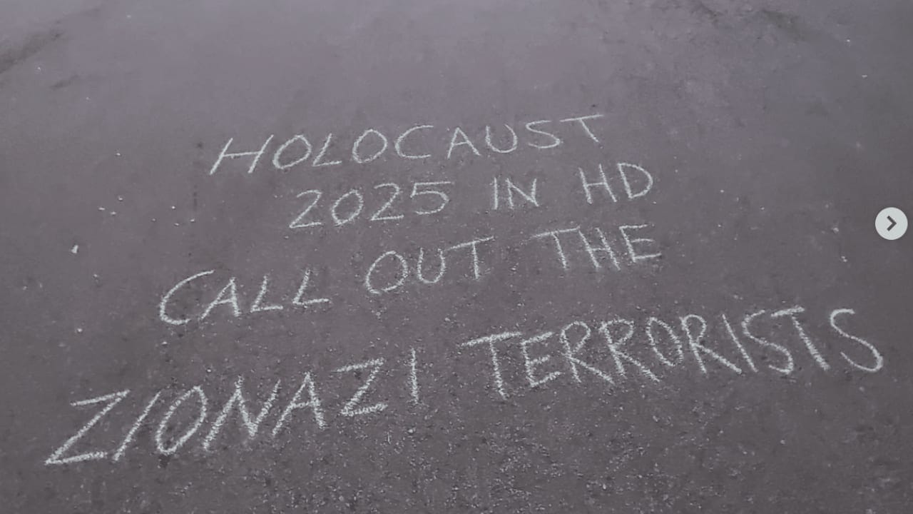 A sign on a sidewalk near Douglas Park in Vancouver, British Columbia