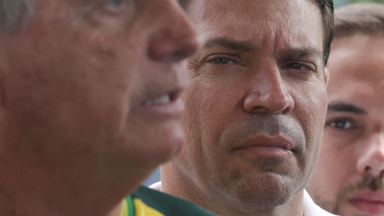 Brazil's former President Jair Bolsonaro talks to media as Rio de Janeiro's candidate for mayor Alexandre Ramagem looks on, after Bolsonaro was voting at a polling station during the municipal elections in Rio de Janeiro, Brazil, October 6, 2024.