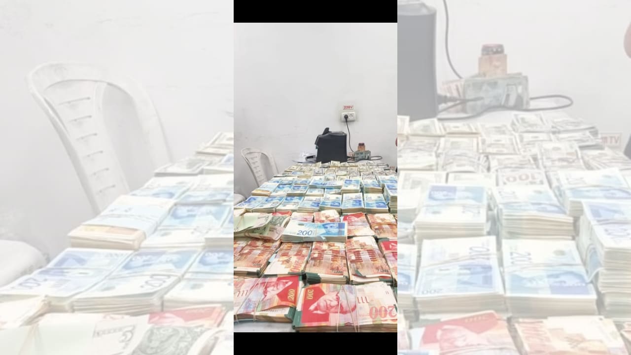 Police officers seize approximately NIS 5m. in cash during raid in Rahat, southern Israel, published April 16, 2026. (photo credit: ISRAEL POLICE)
