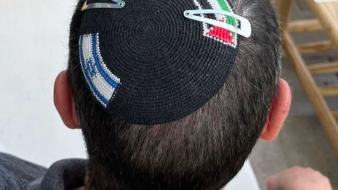A KIPPAH with both an Israeli and Palestinian flag on it.