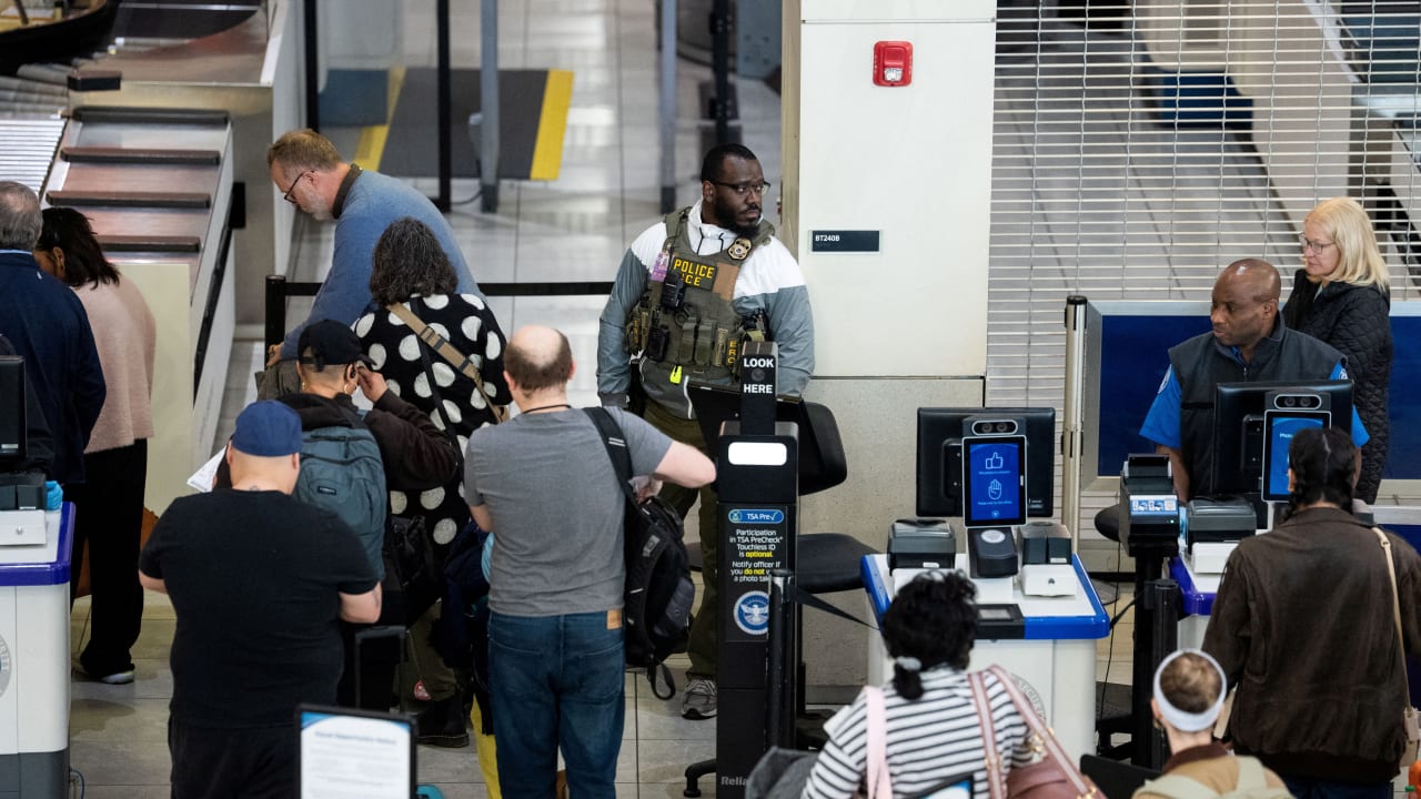 A US Immigration and Customs Enforcement (ICE) agent patrols a TSA security checkpoint in Baltimore/Washington International Thurgood Marshall Airport (BWI) in Baltimore, Maryland, US, March 29, 2026. 
