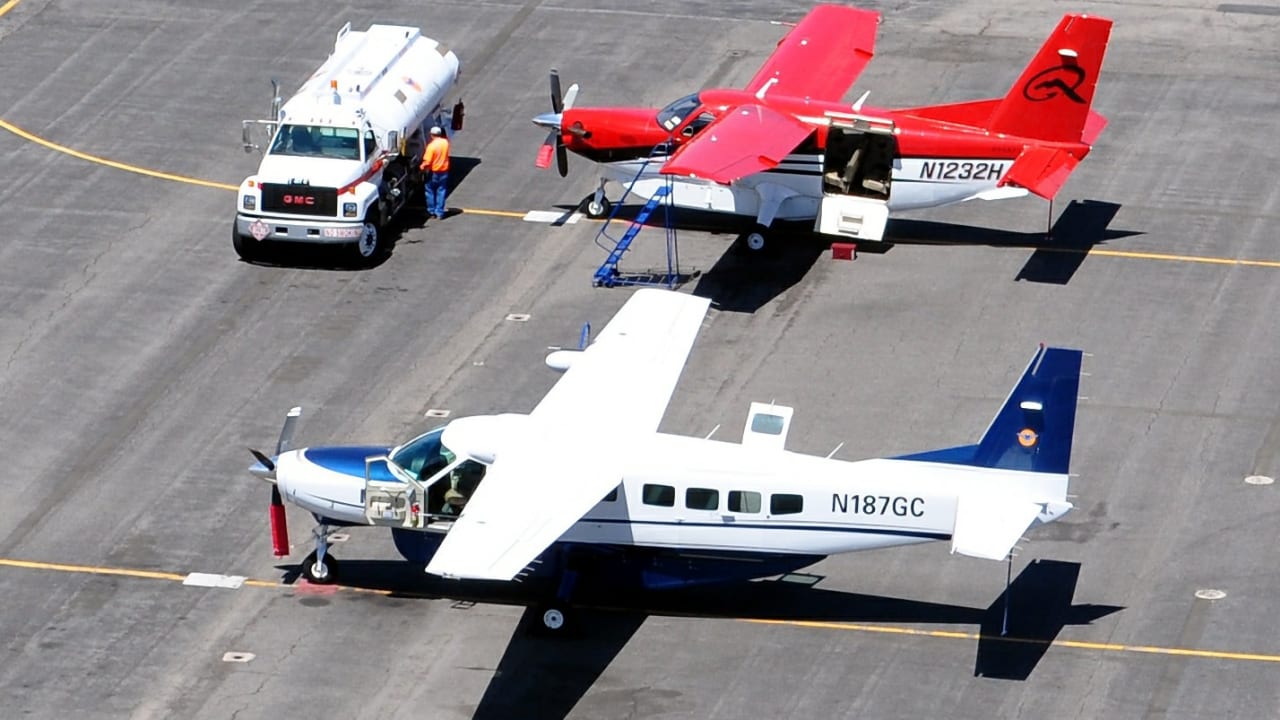 A Cessna 208B Grand Caravan (foreground); illustrative.