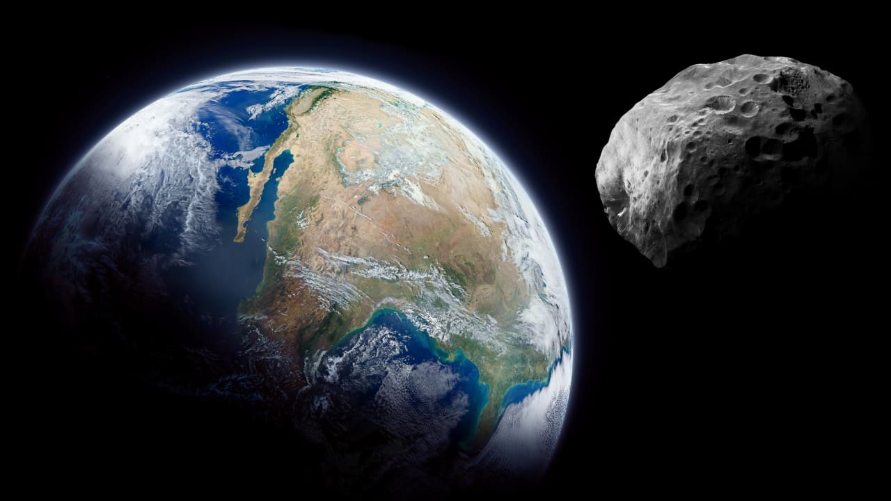 Imagen ilustrativa de un asteroide cerca de la Tierra.